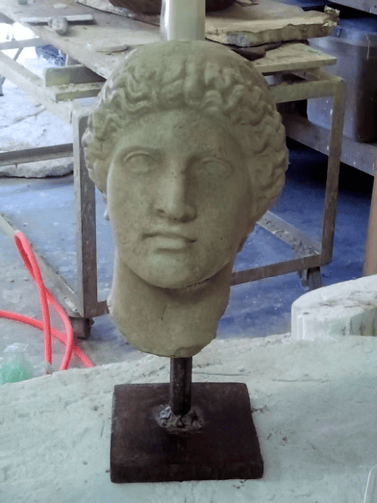 Head of Athene on Iron Stand